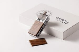 Brightly lit shot of a Silver LVE Orion II with Sonokeling wooden panels resting up against the product packaging